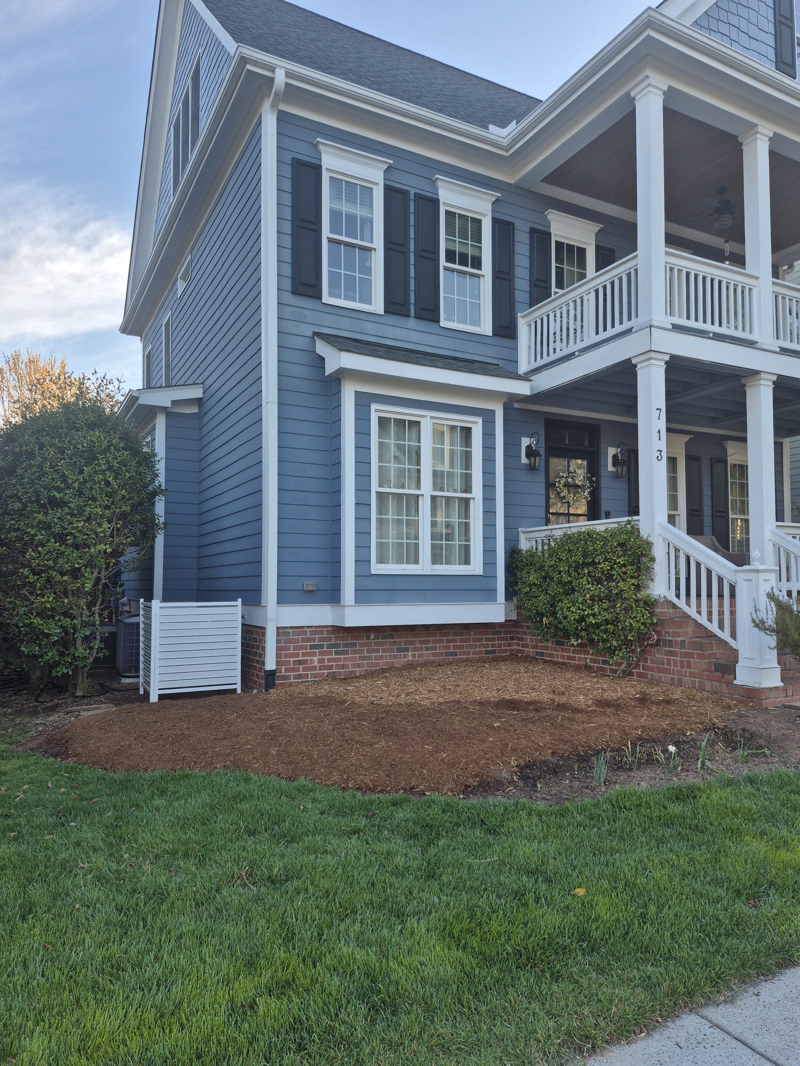 Foundation bed after renovation, mulched and defined